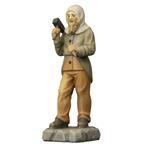 Mountain miner standing with hammer and chisel